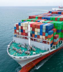 Front of Cargo container ship carrying container and running in international container port customs shipyard sea port concept smart logistic service. Container Ship.